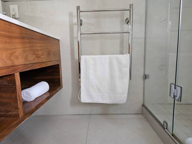 istock Modern Bathroom With Sink, Towel Rack, and Shower 2140843202