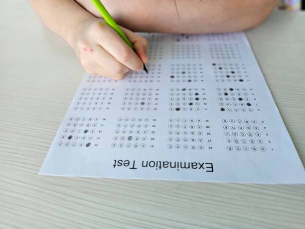 istock optical form of standardized test with answers bubbled and a black pencil examination 2140885058