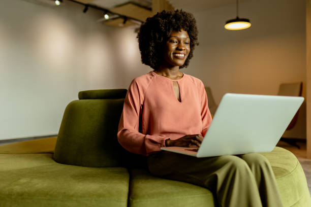 istock Radiant African American entrepreneur innovating at her modern workspace during a peaceful morning 2140892979