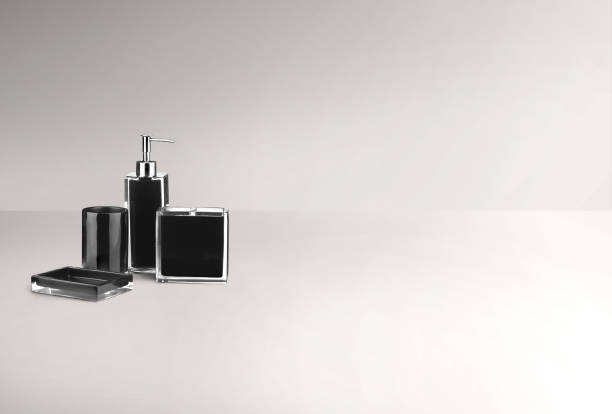 Liquid soap in a  bottle on wooden table in a bathroom. Wooden counter  with space for text and products and accessories.