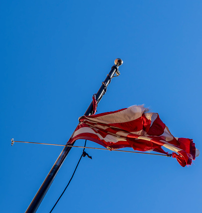 A battered flag after a very blustery spell in Manhattan