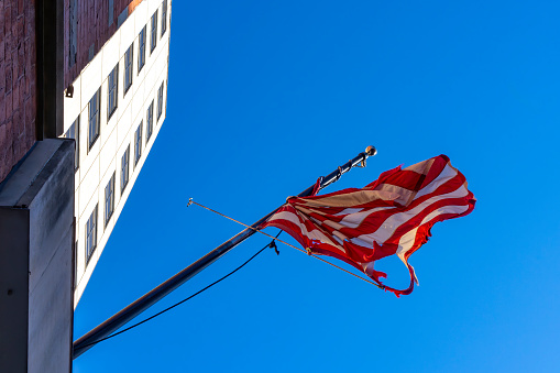 A battered flag after a very blustery spell in Manhattan