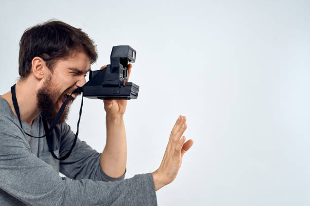 istock photographer with camera hobby technology studio lifestyle creative light background 2140952602