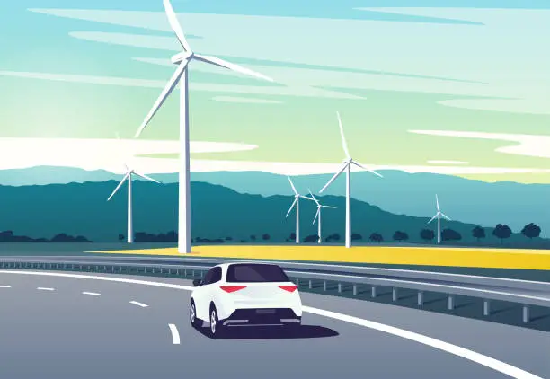 Vector illustration of Vector illustration of a car driving on the highway in the mouuntains along windmills farm