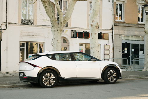 Castelnaudary, France - 28 March, 2024: A Kia EV6 electric car in a town street