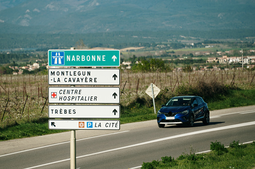 Directional road signs in the outskirts of Carcassonne, France