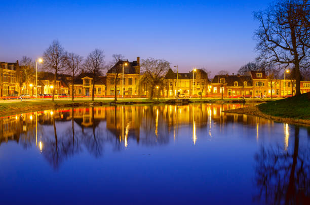 Houses along a Canal in Alkmaar, Netherlands, during dusk