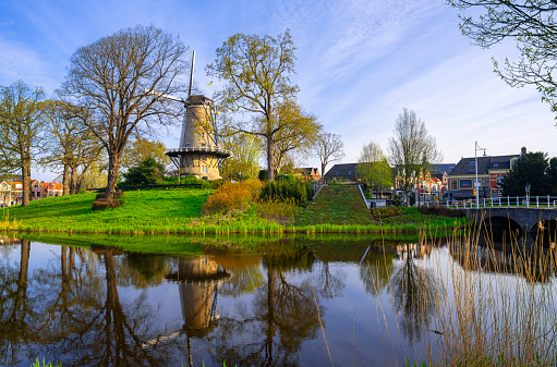 A windmill, the 'Molen van Piet', along a canal in Alkmaar, Netherlands
