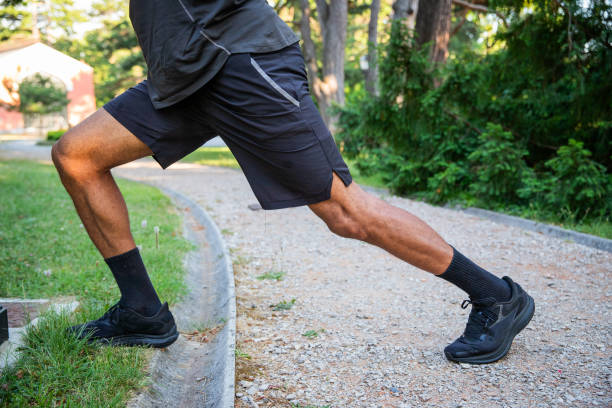 istock A man is stretching his legs on a sidewalk during training 2141052441