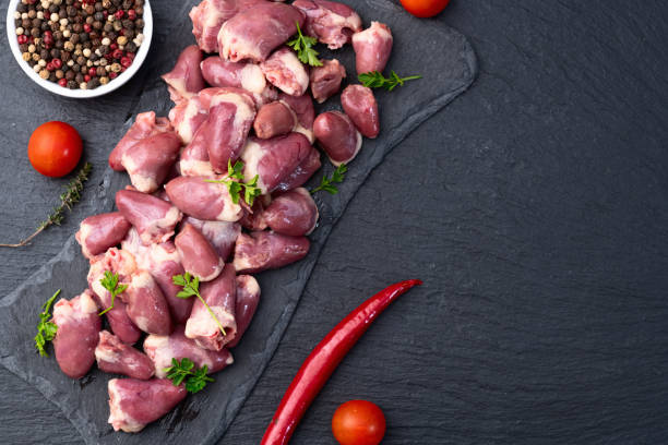 istock Raw chicken giblets hearts , meat background 2141081477