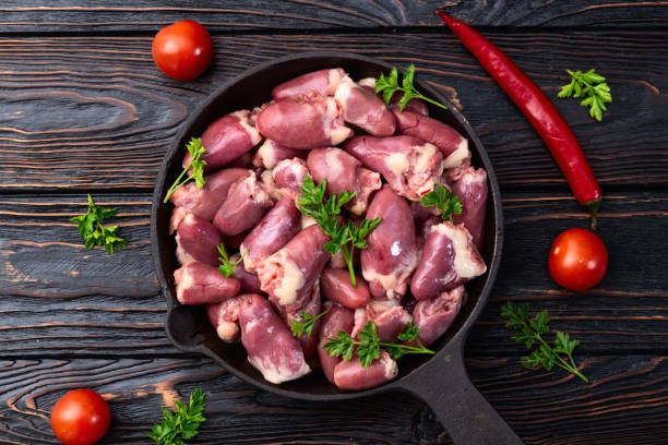 istock Raw chicken giblets hearts , meat background 2141081502