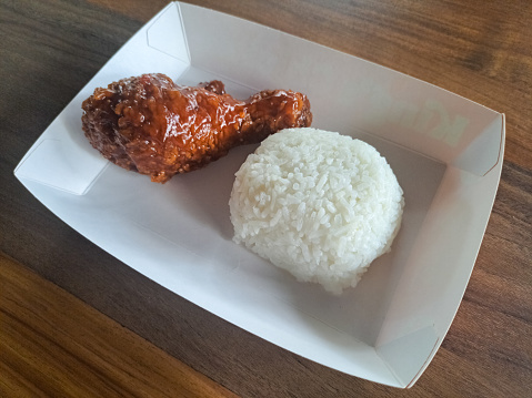 Spicy Chicken Drumsticks With Rice In Lunch Paper Box. Food Menu.