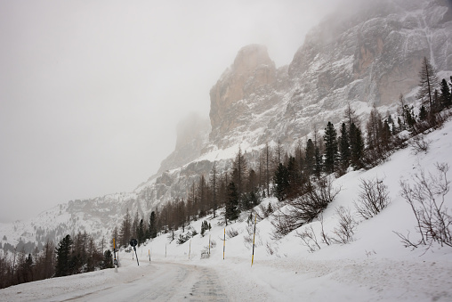 Bad winter weather in mountains on winter road