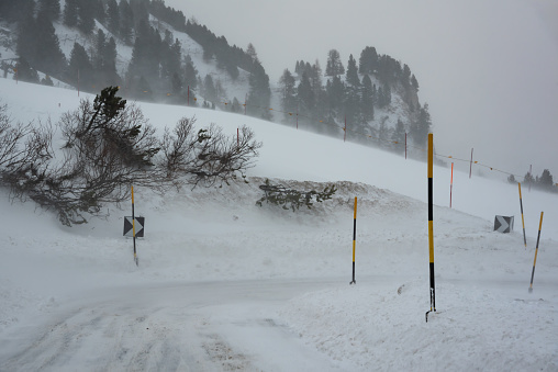 Bad winter weather in mountains on winter road