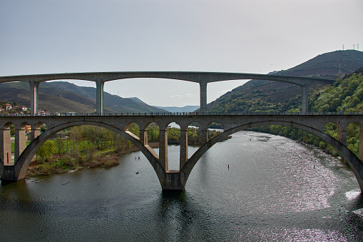 View of the Peso da Regua in the Alto Douro wine region, Portugal - UNESCO World Heritage Site. bridges in the city of Peso da Régua