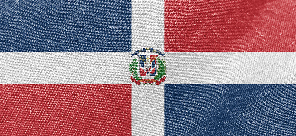 Dominican Republic flag fabric cotton material wide flag wallpaper, Textured national flag of Dominican Republic for graphic and web design purposes.