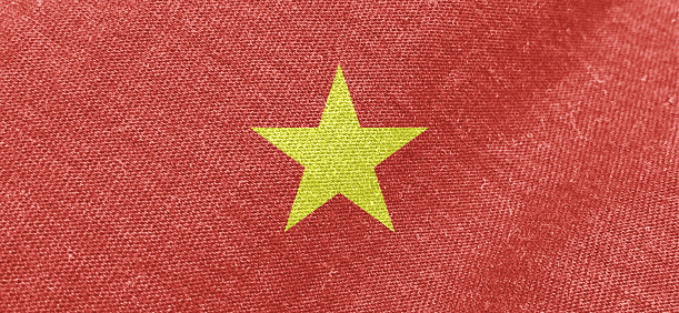 Vietnam flag fabric cotton material wide flag wallpaper, Textured national flag of Vietnam for graphic and web design purposes.