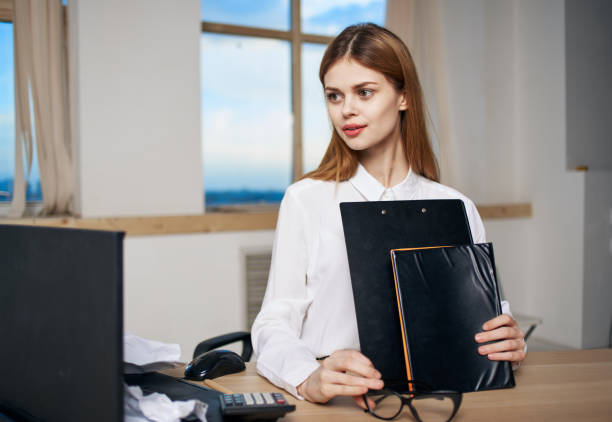 istock Business woman documents office secretary work professional 2141140039
