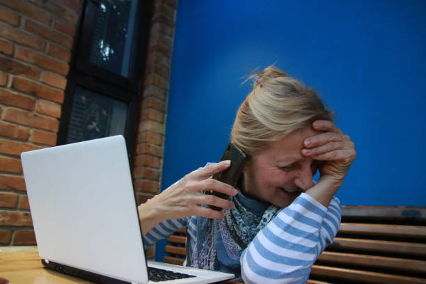 use laptop internet job online smart phone speak talk modern senior