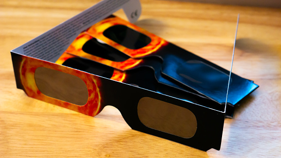 Solar viewers, also known as solar eclipse glasses or solar viewing glasses, which block most visible, ultraviolet, and infrared light so that users may view a solar eclipse safely.