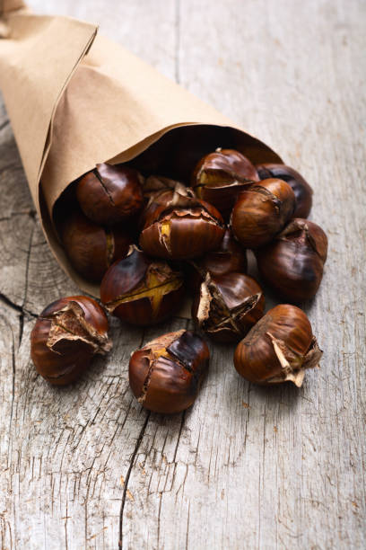 istock Tasty fried chestnut snack background 2141156029