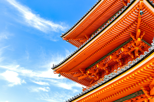 Kyoto, Japan - October 10th, 2023: Detailed Close-up view of the decorative famous Kiyomizu-dera Pagoda under a blue autumn sky in Kyoto Japan.