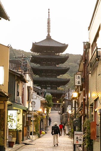 Kyoto, Japan - October 11, 2023: The Yasaka Pagoda and Sannen Zaka Street in the, Gion district in Kyoto, Japan at dusk.
