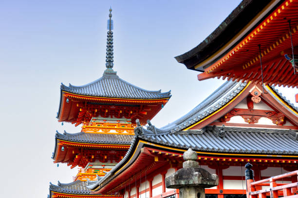 Kyoto, Japan - October 11th, 2023: Beautiful famous Kiyomizu-dera Pagoda and adjacent building under blue autumn sky in Kyoto Japan at sunrise.