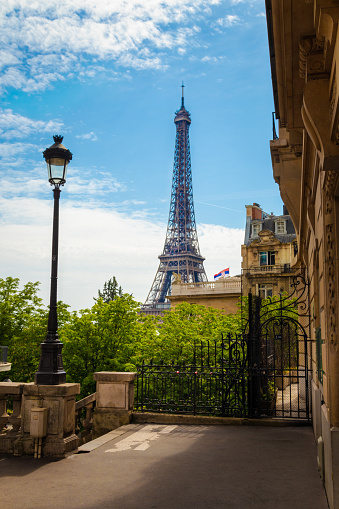 The Tour Eiffel seen from a street of Paris