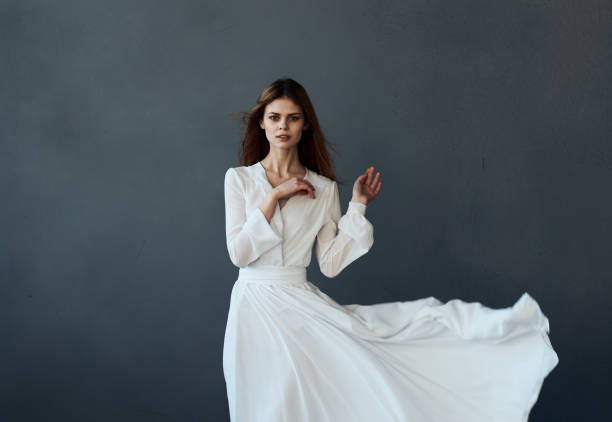 istock beautiful woman white dress dance performed model 2141177853