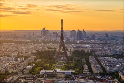 The Tour Eiffel and the panorama of Paris at sunset seen from above at Montparnasse Tower