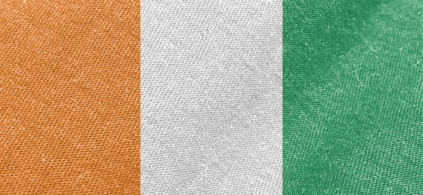 Ivory Coast flag fabric cotton material wide flag wallpaper, Textured national flag of Ivory Coast for graphic and web design purposes.