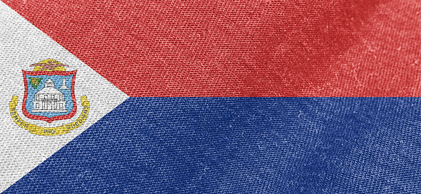 Sint Maarten Dutch part flag fabric cotton material wide flag wallpaper, Textured national flag of Sint Maarten for graphic and web design purposes.