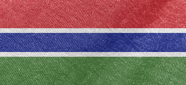 Gambia flag fabric cotton material wide flag wallpaper, Textured national flag of Gambia for graphic and web design purposes.