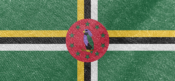Dominica flag fabric cotton material wide flag wallpaper, Textured national flag of Dominica for graphic and web design purposes.