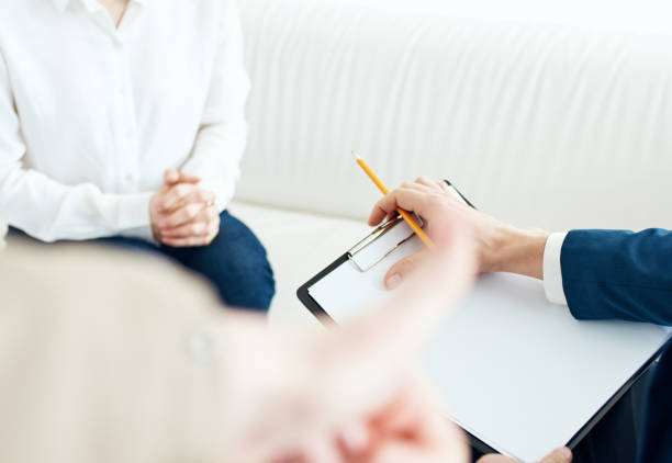 istock woman at the reception with a psychologist indoors documents cropped view 2141206177