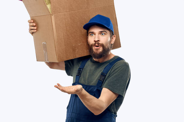 istock A man in a working uniform with a box in his hands delivery transportation work 2141223836