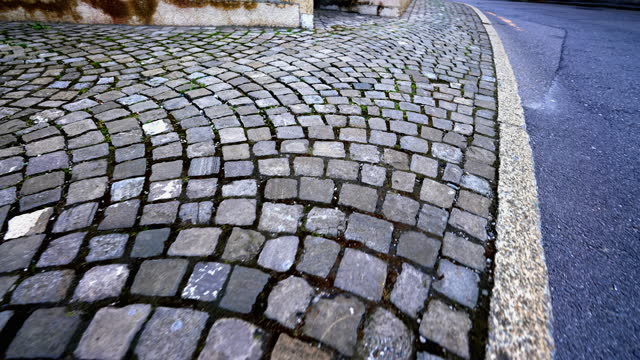 Legacy in Stone - Detailed View of Centuries-Old Cobblestones, Footprints of Tradition in Motion