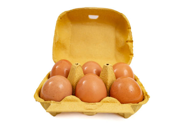 6 eggs yellow carton pack, front view isolated on white