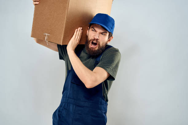istock Male worker loading delivery boxes in hands packing lifestyle 2141243485