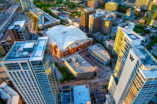 Dallas, United States - March 28, 2024:  Aerial view of the American Airlines Center in downtown Dallas, Texas; a multi-purpose venue serving as the home of the NBA's Dallas Mavericks and the NHL's Dallas Stars as well as a popular venue for concerts shot via helicopter from an altitude of about 800 feet.
