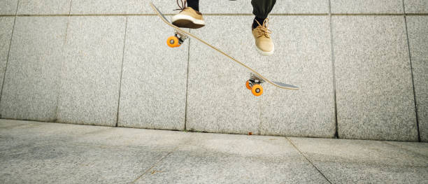 istock Skateboarder skateboarding in modern city 2141276046