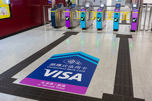 Hong Kong - April 3, 2024 : Fare gates at the MTR Hung Hom Station in Hong Kong. Passengers can pay the fare by Octopus, Single Journey Ticket, QR code e-wallets, or contactless credit card payment.