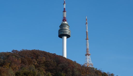 The iconic N Seoul Tower, situated atop Mount Namsan, is also referred to as the YTN Tower, Namsan Tower, and Seoul Tower. Rising 236 meters above sea level, it offers breathtaking views of the city.