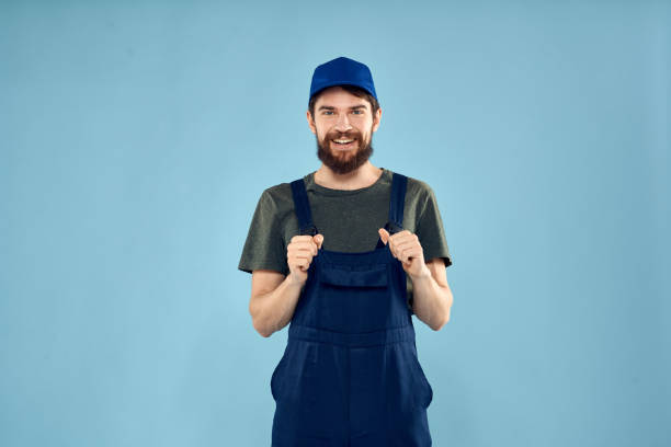 istock man in work uniform uniform professional work lifestyle delivery service blue background 2141297796