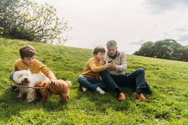 istock Grandfather and grandson using phone 2141317461