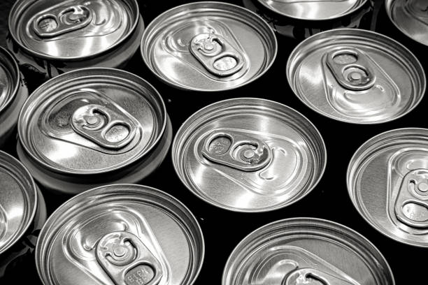 istock Lots aluminum soda or beer cans as background. Black and white image. 2141329582