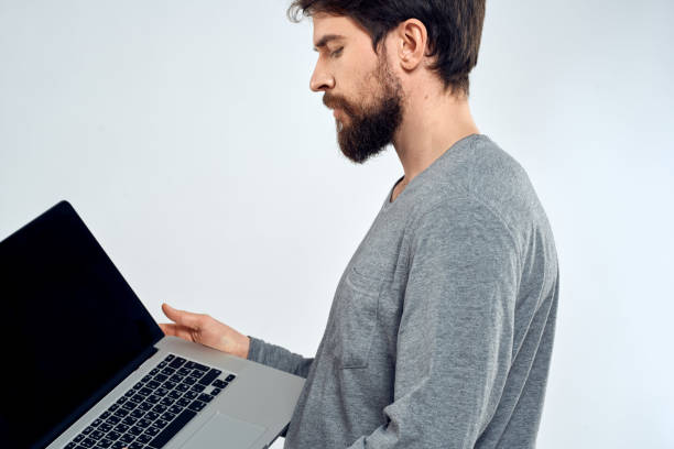 istock A man in a gray sweater with a laptop hands lifestyle technology communication internet work 2141351747