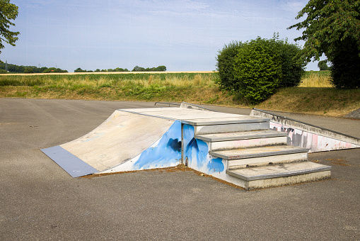 Skate park with different halfpipes in summer