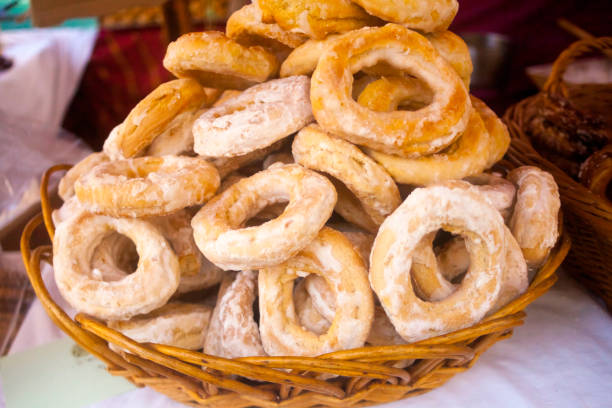 istock Fried doughnuts, rosquillas,  covered with sugar, close-up view. 2141400077